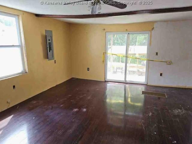 120 Rainbow Cir, Madison, WV 25130 - empty room featuring wood finished floors, a ceiling fan, electric panel, and healthy amount of natural light