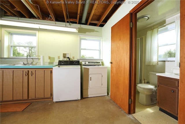 5126 Big Tyler Rd, Cross Lanes, WV 25313 - washroom with cabinet space, washing machine and clothes dryer, and plenty of natural light