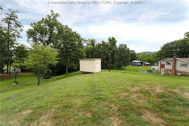 5126 Big Tyler Rd, Cross Lanes, WV 25313 - view of grassy yard with a shed