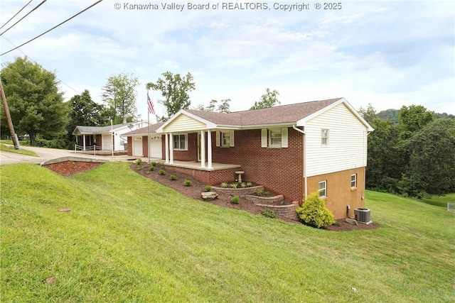 5126 Big Tyler Rd, Cross Lanes, WV 25313 - view of front of property with a garage, a front lawn, a porch, and driveway