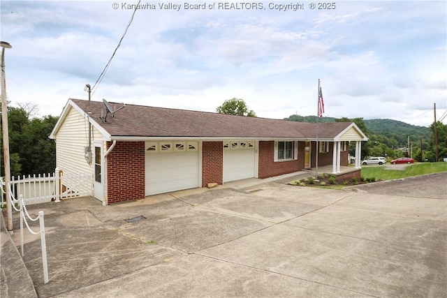 5126 Big Tyler Rd, Cross Lanes, WV 25313 - ranch-style house with brick siding, a porch, concrete driveway, a shingled roof, and an attached garage