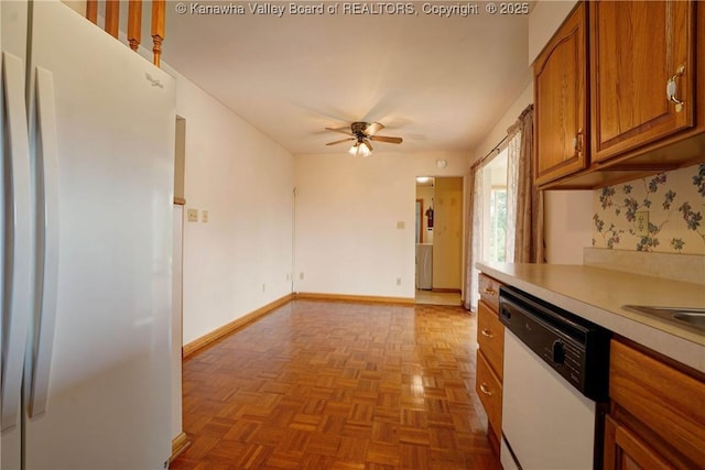 5126 Big Tyler Rd, Cross Lanes, WV 25313 - kitchen featuring white appliances, brown cabinets, light countertops, and a ceiling fan