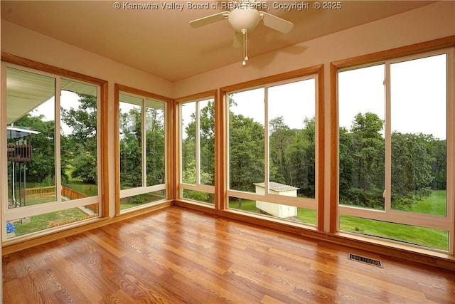5126 Big Tyler Rd, Cross Lanes, WV 25313 - unfurnished sunroom with wood finished floors