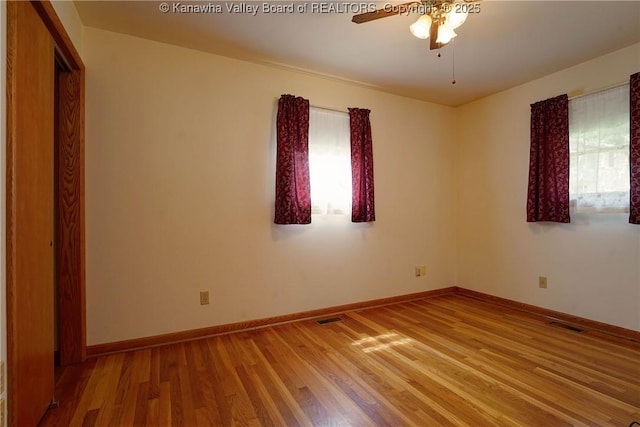 5126 Big Tyler Rd, Cross Lanes, WV 25313 - unfurnished room featuring ceiling fan and wood finished floors