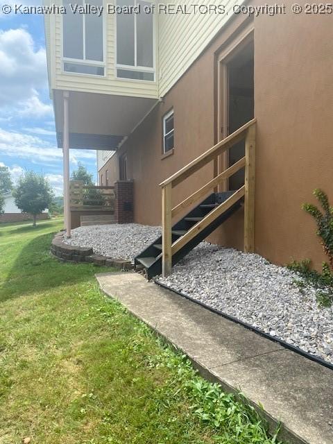 5126 Big Tyler Rd, Cross Lanes, WV 25313 - view of property exterior featuring a yard and stucco siding