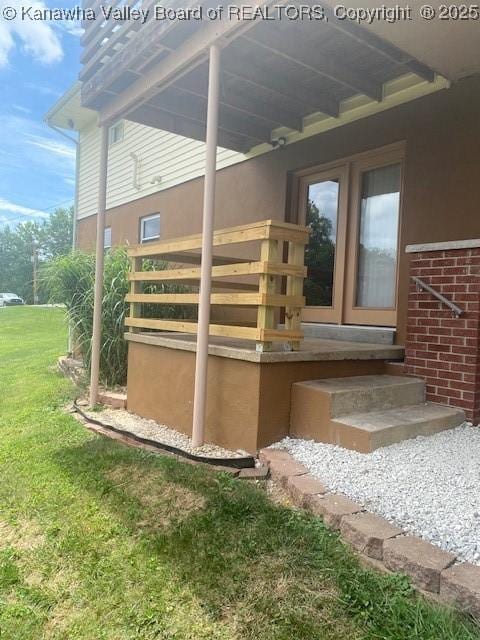5126 Big Tyler Rd, Cross Lanes, WV 25313 - entrance to property with brick siding and a yard