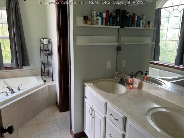 14 Perkins Way, Cross Lanes, WV 25313 - bathroom with a garden tub, tile patterned floors, and double vanity