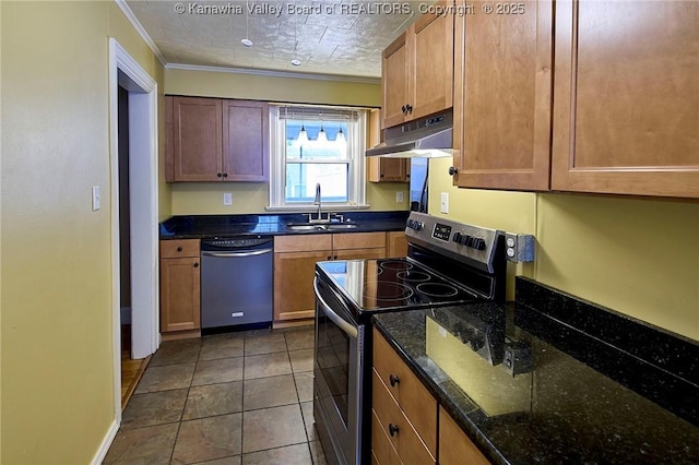 5309 Venable Ave SE, Charleston, WV 25304 - kitchen featuring stainless steel appliances, under cabinet range hood, ornamental molding, dark stone countertops, and dark tile patterned flooring
