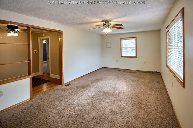 5309 Venable Ave SE, Charleston, WV 25304 - spare room featuring ceiling fan, carpet flooring, and a textured ceiling