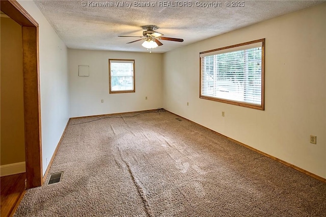 5309 Venable Ave SE, Charleston, WV 25304 - carpeted empty room with a textured ceiling and ceiling fan