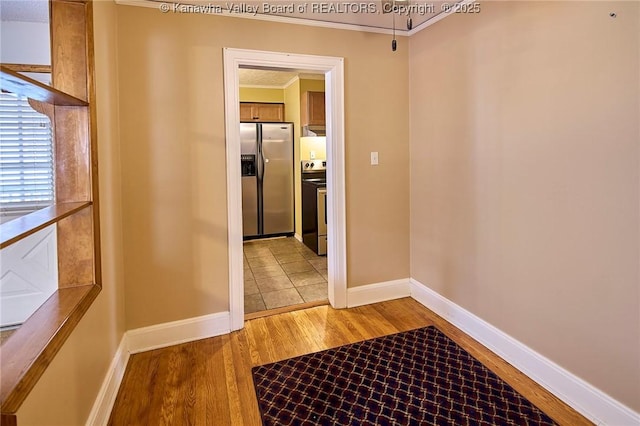 5309 Venable Ave SE, Charleston, WV 25304 - hallway featuring ornamental molding and light wood-style floors