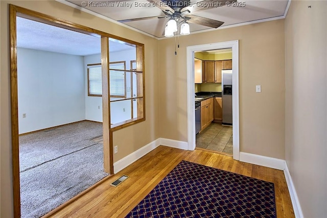 5309 Venable Ave SE, Charleston, WV 25304 - doorway to outside with ceiling fan, light wood-style floors, and crown molding