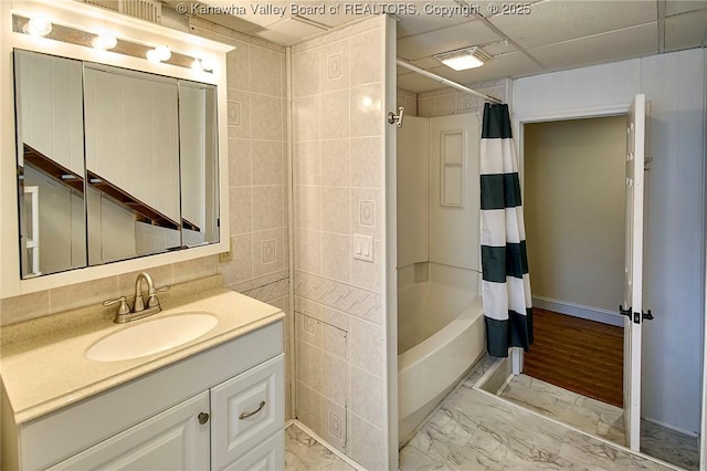 5309 Venable Ave SE, Charleston, WV 25304 - full bathroom with vanity, marble finish flooring, shower / tub combo, and tile walls