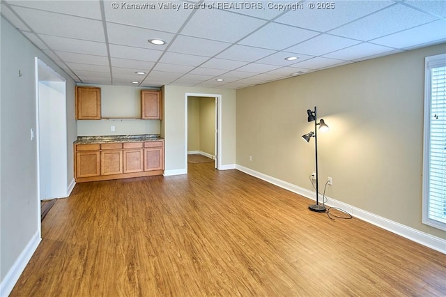 5309 Venable Ave SE, Charleston, WV 25304 - unfurnished living room with wood finished floors, a drop ceiling, and recessed lighting