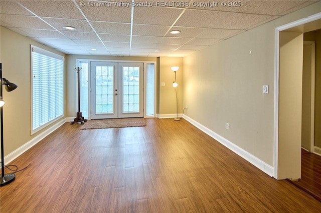 5309 Venable Ave SE, Charleston, WV 25304 - unfurnished room featuring a drop ceiling, french doors, and wood finished floors