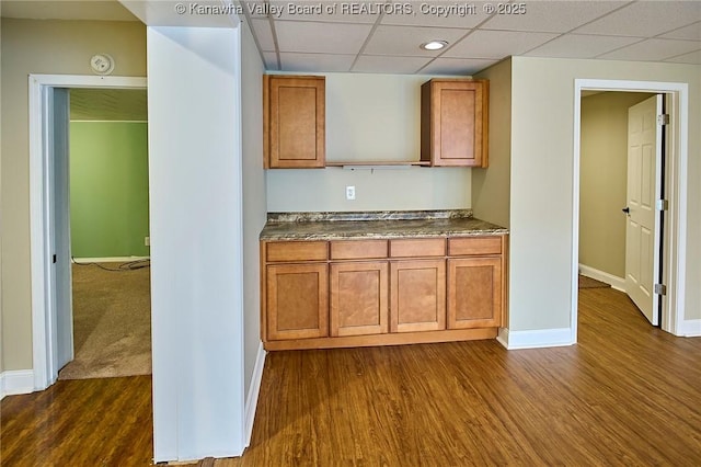 5309 Venable Ave SE, Charleston, WV 25304 - kitchen featuring a paneled ceiling, dark countertops, brown cabinets, dark wood finished floors, and open shelves