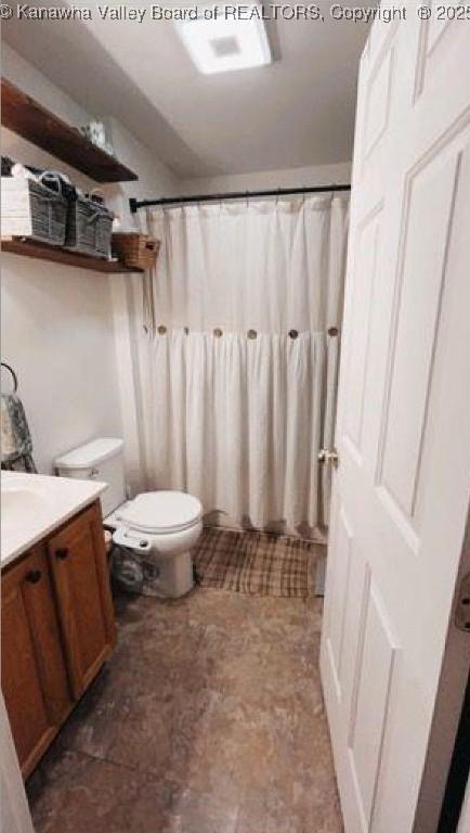 59 Pleasant Ln, Grantsville, WV 25147 - bathroom with vanity and a shower with shower curtain