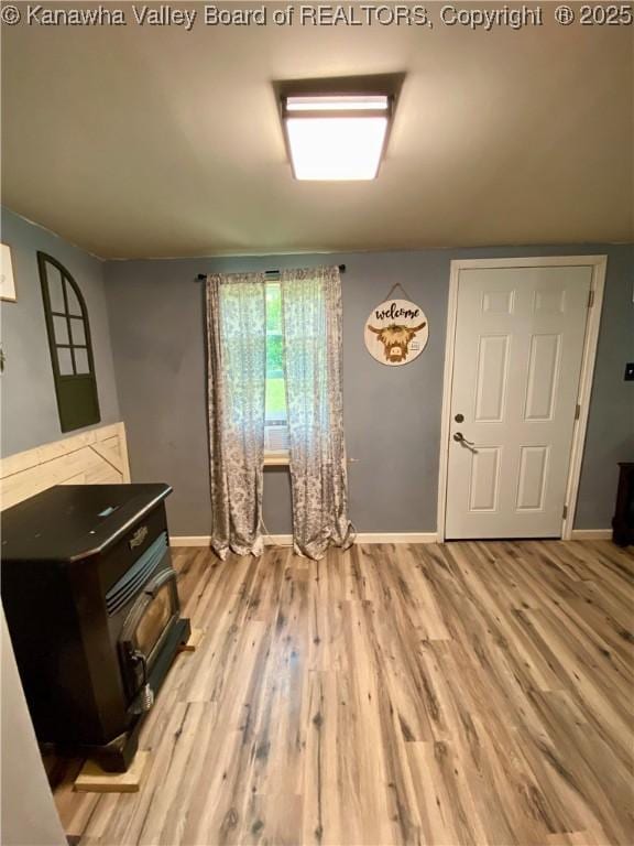 1091/2 Hillcrest Dr, Ripley, WV 25271 - entryway with a wood stove and wood finished floors