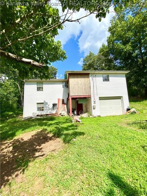 1091/2 Hillcrest Dr, Ripley, WV 25271 - rear view of house featuring a lawn and a garage