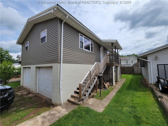 814 Madison Ave, Spencer, WV 25276 - view of side of property with a garage, stairway, and driveway
