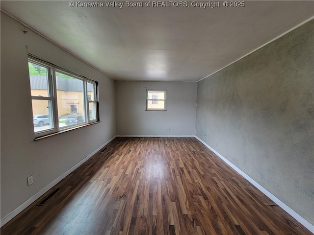 814 Madison Ave, Spencer, WV 25276 - empty room with dark wood-type flooring and baseboards