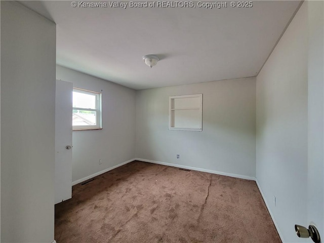 814 Madison Ave, Spencer, WV 25276 - carpeted spare room with baseboards