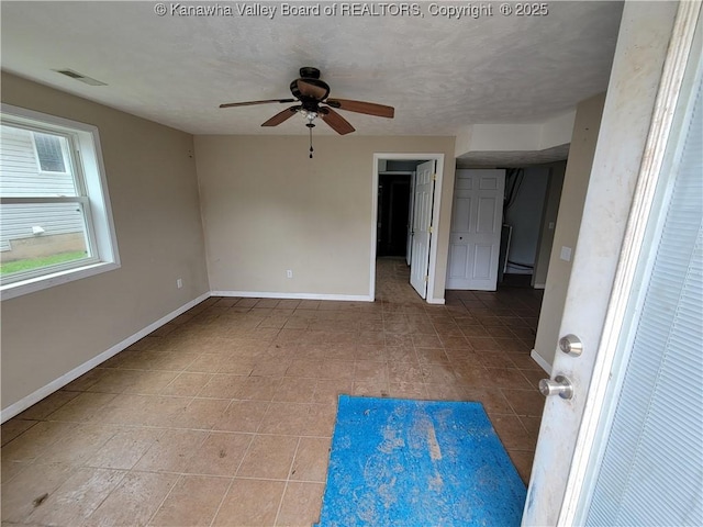 814 Madison Ave, Spencer, WV 25276 - empty room with ceiling fan and tile patterned floors