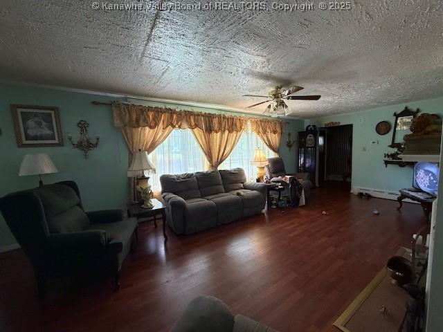 1022 Riverside Dr, Welch, WV 24801 - living area featuring a textured ceiling, wood finished floors, ceiling fan, and a baseboard heating unit