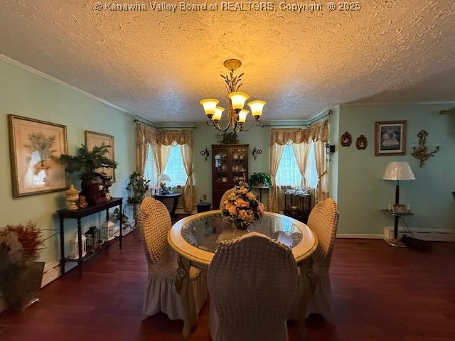 1022 Riverside Dr, Welch, WV 24801 - dining room with a chandelier, wood finished floors, crown molding, healthy amount of natural light, and a textured ceiling
