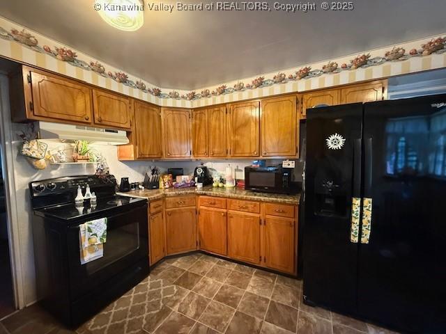 1022 Riverside Dr, Welch, WV 24801 - kitchen featuring black appliances, under cabinet range hood, and brown cabinetry