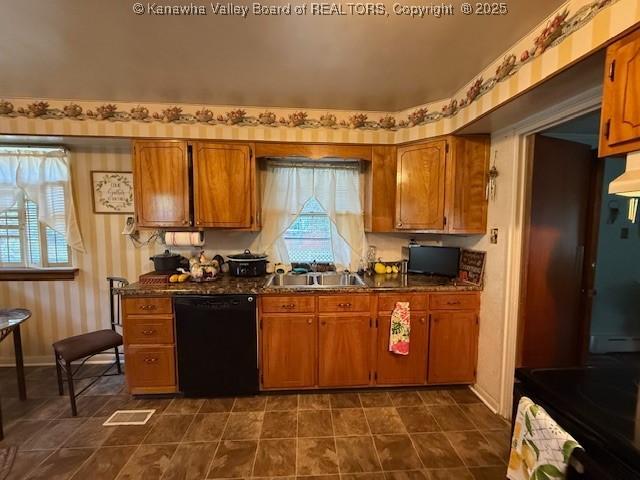 1022 Riverside Dr, Welch, WV 24801 - kitchen featuring black appliances, brown cabinets, and dark countertops