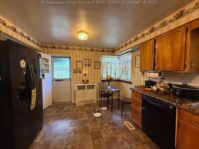 1022 Riverside Dr, Welch, WV 24801 - kitchen featuring black appliances, radiator heating unit, dark countertops, brown cabinets, and wallpapered walls