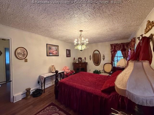 1022 Riverside Dr, Welch, WV 24801 - bedroom featuring wood finished floors, a textured ceiling, and a chandelier