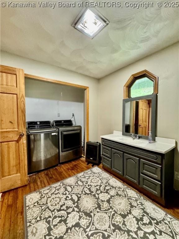 28 Brushy Frk, Alkol, WV 25501 - kitchen featuring washer and clothes dryer, dark wood-style floors, and light countertops
