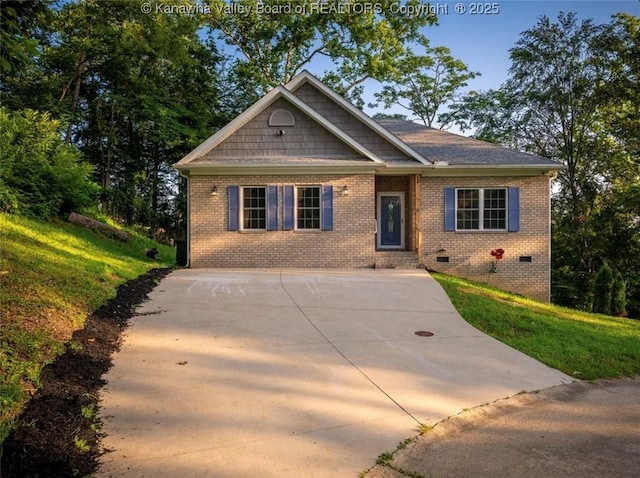 6 Squires Dr, Saint Albans, WV 25177 - view of front of home featuring concrete driveway, brick siding, and crawl space