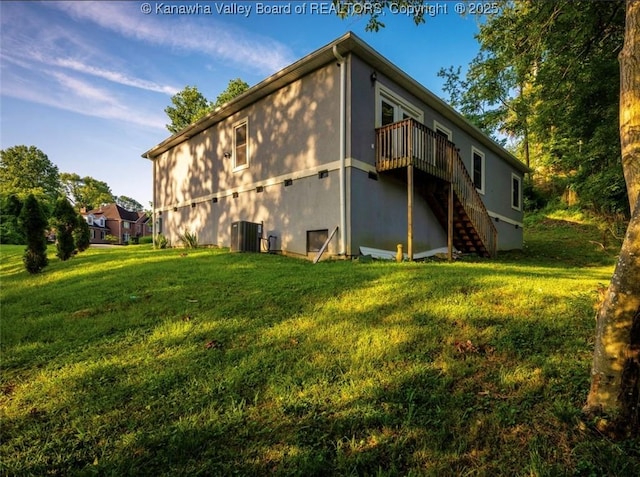 6 Squires Dr, Saint Albans, WV 25177 - back of property with stairs, a yard, a deck, and stucco siding