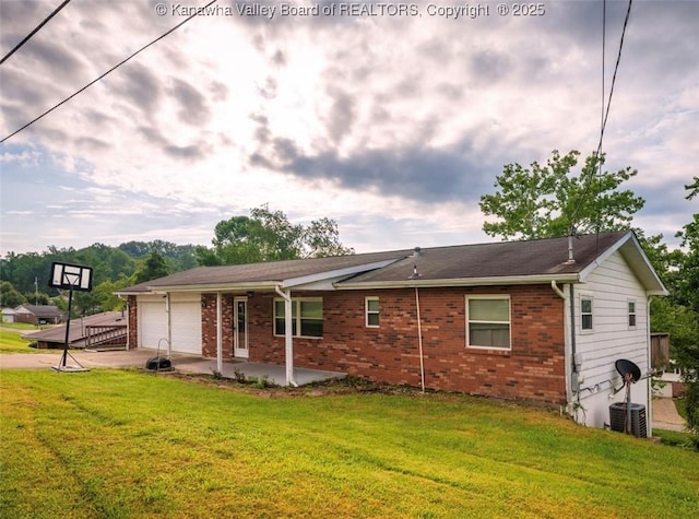 105 Lincoln Hts, Alum Creek, WV 25003 - view of front of house with driveway, a front lawn, a garage, and brick siding