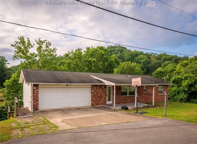 105 Lincoln Hts, Alum Creek, WV 25003 - single story home featuring brick siding, an attached garage, driveway, a front lawn, and a forest view