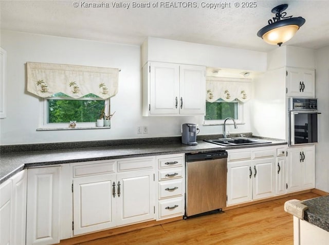 105 Lincoln Hts, Alum Creek, WV 25003 - kitchen featuring dark countertops, dishwasher, oven, and healthy amount of natural light