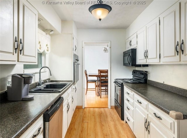 105 Lincoln Hts, Alum Creek, WV 25003 - kitchen with black appliances, dark countertops, light wood-style flooring, and white cabinets