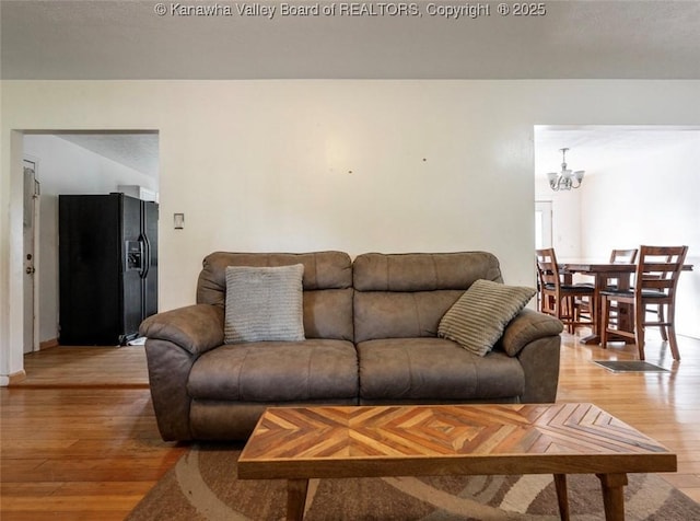 105 Lincoln Hts, Alum Creek, WV 25003 - living room with light wood-style flooring and a chandelier