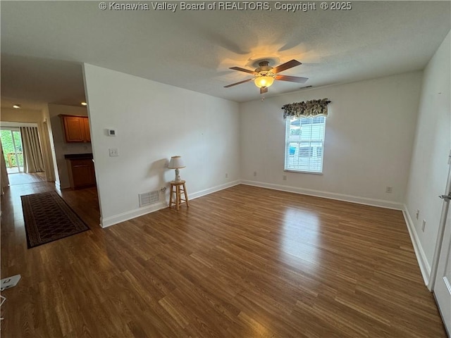 2314 Harrison Ave, Saint Albans, WV 25177 - spare room featuring plenty of natural light, ceiling fan, and dark wood finished floors