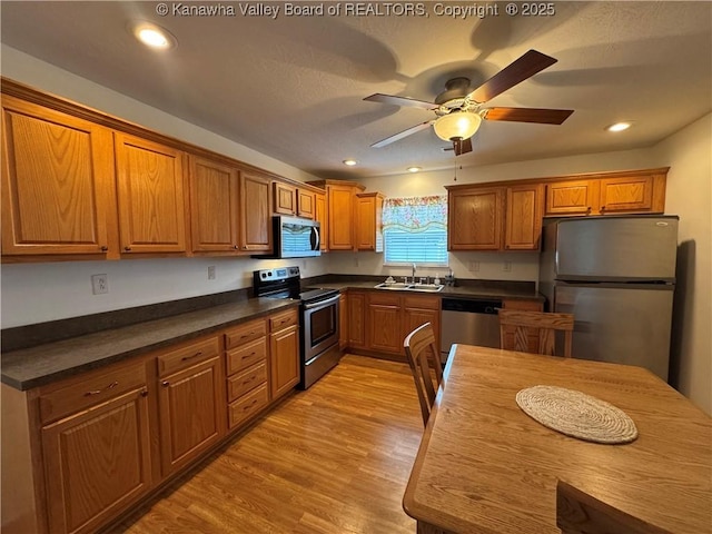 2314 Harrison Ave, Saint Albans, WV 25177 - kitchen featuring stainless steel appliances, brown cabinets, light wood-style flooring, and recessed lighting