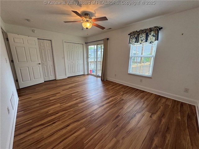 2314 Harrison Ave, Saint Albans, WV 25177 - unfurnished bedroom with multiple closets, wood finished floors, a ceiling fan, and access to outside