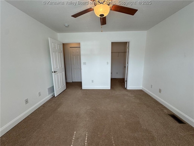2314 Harrison Ave, Saint Albans, WV 25177 - unfurnished bedroom featuring carpet floors, a walk in closet, and a ceiling fan