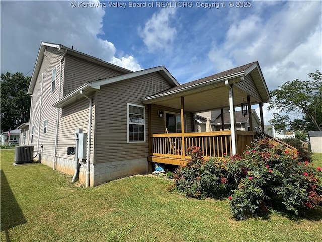 2314 Harrison Ave, Saint Albans, WV 25177 - view of property exterior with a lawn and a central AC unit