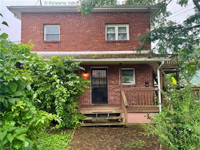 100 22nd St, Dunbar, WV 25064 - view of front of property with brick siding and a porch
