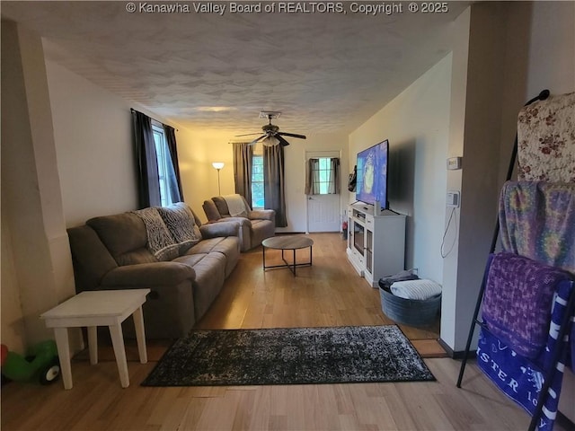 1832 Roxalana Rd, Dunbar, WV 25064 - living area featuring light wood-style flooring, ceiling fan, and a textured ceiling