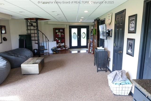 282 Dupont Rd, Poca, WV 25159 - carpeted living room with stairs, recessed lighting, and a drop ceiling
