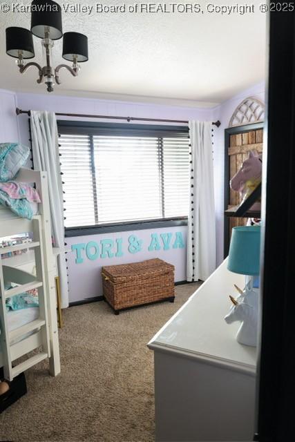 282 Dupont Rd, Poca, WV 25159 - carpeted bedroom featuring a chandelier